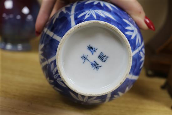 A Chinese blue and white dragon vase and a flambe vase tallest 22.5cm